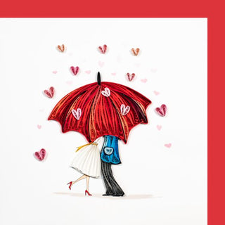 Quilled card pair under umbrella